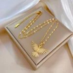 Elegant phoenix bird necklace crafted from stainless steel and gold plating